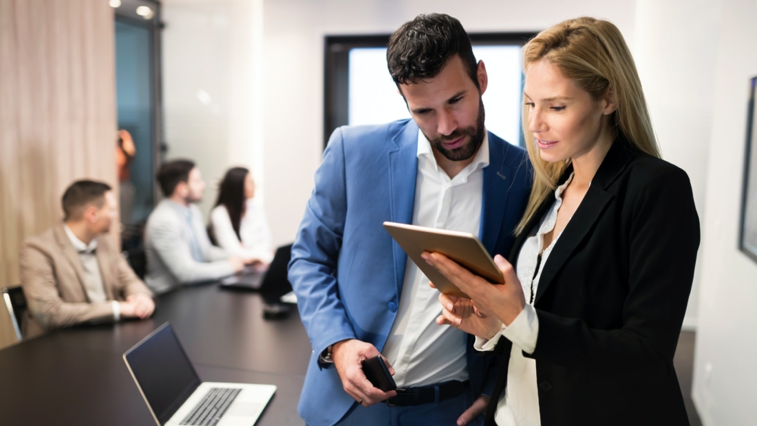 attractive-business-couple-using-tablet-in-their-company.jpg